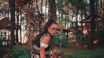 A Traditional Javanese Man with an Intense Gaze in the Forest video