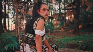 A Javanese Man Performing a Traditional Dance in the Forest video