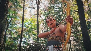 Traditional Javanese Archer Aiming Bow in a Forest video