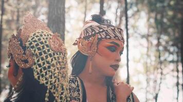 Close Up of Two Javanese Dancers Sharing a Somber Moment video