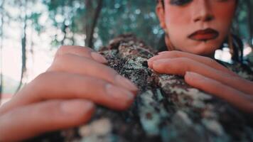 Javanese Dancer Touching Tree Bark in a Forest video