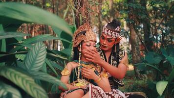 Playful Javanese Dancers Sharing a Joyful Moment video
