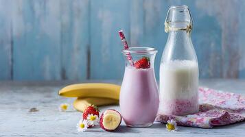 Pink Strawberry Banana Smoothie with Fresh Fruit and Milk. photo