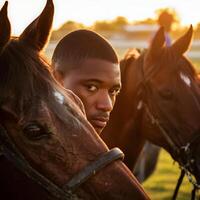 A Man and His Horses Share a Moment in the Golden Hour Light. photo