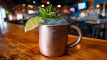 Refreshing Moscow Mule cocktail with lime and mint in copper mug. photo
