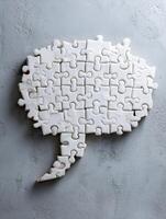 Creative Teamwork Concept Featuring Puzzle Pieces Arranged in a Speech Bubble Shape Against a Minimalistic Background for Collaboration Ideas photo