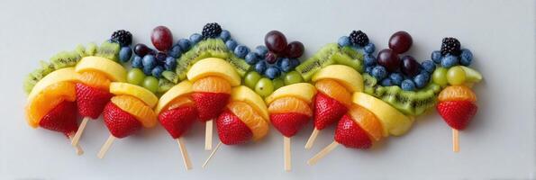 Rainbow Fruit Skewers Create a Colorful Wave Design for a Delightful Summer Snack photo