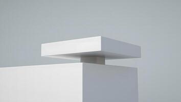 Minimalist abstract composition of white geometric shapes against a soft grey background photo