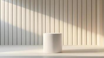 Minimalist interior with a cylindrical pedestal bathed in warm sunlight and shadow photo