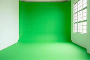 Empty green screen studio with a seamless backdrop and a large window letting in natural light photo