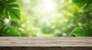 Rustic wooden table with lush green monstera leaves and soft bokeh background photo