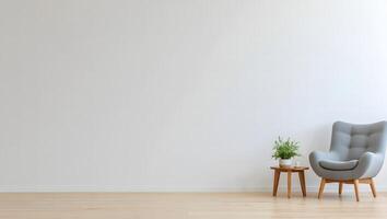 Minimalist interior scene with a comfortable grey armchair and a small wooden side table with a potted plant photo