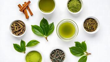 Arrangement of green tea leaves powder and drink with cinnamon sticks and dried herbs photo