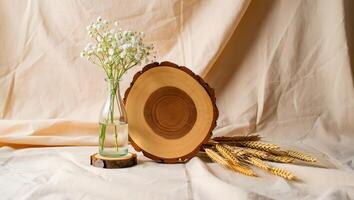 Delicate white baby s breath flowers in a glass vase with a wooden slice and wheat stalks photo