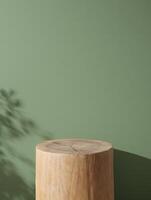 Natural wooden log podium with soft leaf shadows on a muted green background photo