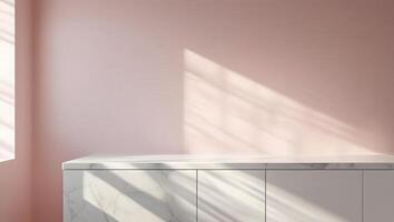 Soft pink wall with marble countertop and dappled sunlight creating a serene and modern interior scene photo