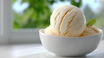 Creamy vanilla ice cream dessert with fresh mint garnish and bright background photo