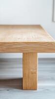 Close-up of a beautifully crafted modern wooden table, showcasing its natural wood grain and elegant minimalist design for contemporary interior spaces. photo