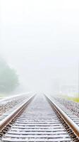 Misty Railway Tracks Disappearing into the Fog A Serene and Mysterious Journey Along Vanishing Train Lines in Atmospheric Rural Landscape photo