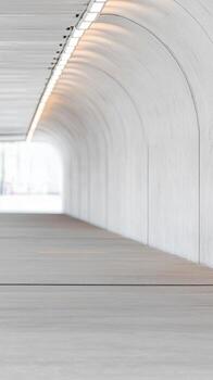 A captivating minimalist architectural tunnel, bathed in soft, ethereal light, creating an infinite perspective and serene, modern urban pathway. photo