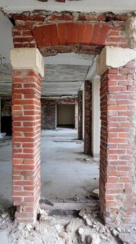 Rustic Brick Archway and Columns in a Dilapidated Building Interior. Historic Architecture Undergoing Renovation, Revealing Raw Textures. photo