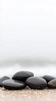 Smooth, Dark Wet Stones on a Tranquil Beach Shore. Serene Coastal Landscape with Natural Pebbles, Evoking Calm and Peaceful Harmony photo