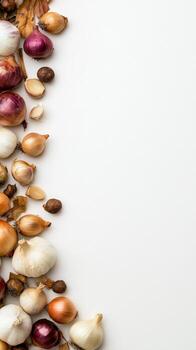A vibrant array of fresh onions and garlic bulbs, showcasing diverse colors and textures, artfully arranged on a clean white background, perfect for culinary themes. photo