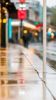 Captivating urban street scene after a refreshing rain, showcasing vibrant reflections on wet pavement under soft city lights and atmospheric bokeh. photo