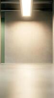Modern Minimalist Interior Space with Bright Overhead Light Illuminating a Textured Wall and Reflective Floor, Creating a Clean Architectural Backdrop. photo