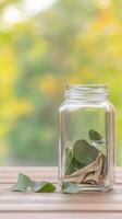 Captivating still life of vibrant green leaves in a transparent glass jar, resting on a rustic wooden surface amidst a soft, sun-dappled natural backdrop. photo
