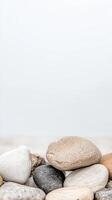 Artful Arrangement of Smooth River Stones and Pebbles in Natural Hues, Perfect for Tranquil Zen Decor, Spa Concepts, or Organic Backgrounds photo
