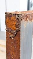 Intricate close-up of a naturally rusted industrial steel beam, highlighting the raw beauty of corrosion and weathered textures. Perfect for backgrounds. photo