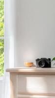 Aesthetic Still Life Classic Camera and Wooden Bowl on a Minimalist Tabletop, Bathed in Soft Morning Light for Serene Lifestyle Photography. photo