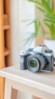 Modern Digital Mirrorless Camera on a Wooden Table in a Bright Home Setting, Perfect for Photography Enthusiasts and Creative Content Creators photo