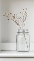 A captivating still life of delicate dried flowers in a clear glass vase, embodying minimalist elegance and natural serenity for modern home decor. photo