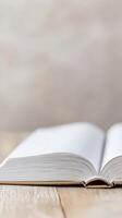 Open Book with Pristine Blank Pages Resting on a Warm Wooden Surface, Evoking Serenity and the Pursuit of Knowledge and New Beginnings. photo