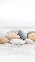 Tranquil Beach Pebbles A Close-up Study of Smooth, Natural Stones on a Serene Shoreline, Capturing Earth's Gentle Textures and Hues. photo