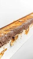 Close-up of vibrant rust and peeling white paint on an aged metal surface, showcasing the intricate textures of corrosion and decay. A detailed abstract background. photo