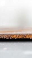 Close-up of a vibrant, textured rusty metal surface revealing intricate corrosion and aged decay, perfect for industrial backgrounds and abstract design elements. photo