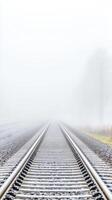 Misty Train Tracks Vanishing into Fog A Mysterious Journey Filled with Solitude and Possibility photo
