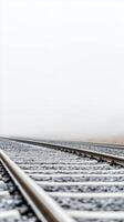Ethereal Railway Tracks Vanishing into a Dense Foggy Horizon, a Serene and Mysterious Path Leading into the Unknown Distance photo