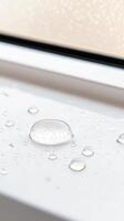 Exquisite Macro Photography Crystal Clear Water Droplets Adorning a White Window Sill, Capturing Serene Reflections and Natural Purity photo