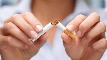 Hands breaking a cigarette. photo