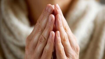 Hands clasped in prayer photo