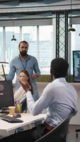 Vertical Programmer requests help from team leader to fix hacking attempt on corporate network. IT employee and manager investigating unauthorized access alerts, doing brainstorming, camera A video
