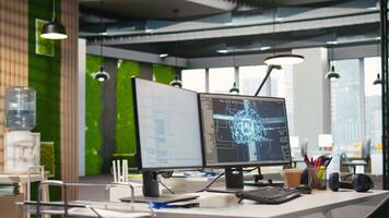 Empty startup office with artificial intelligence program running on PC monitors used by programmers. AI industry startup workspace leveraging machine learning technology video