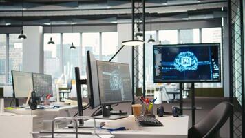 PC monitor on startup office desk showing artificial intelligence neural networks programming languages. Computer in company workspace used for AI deep learning software testing and quality assurance video