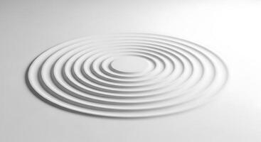 Concentric ripples on a white surface photo