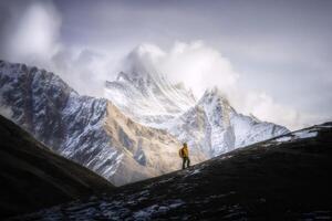 Hiker in Snowy Mountain Landscape photo