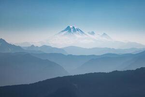 Distant Blue Mountain Range under Hazy Sky photo